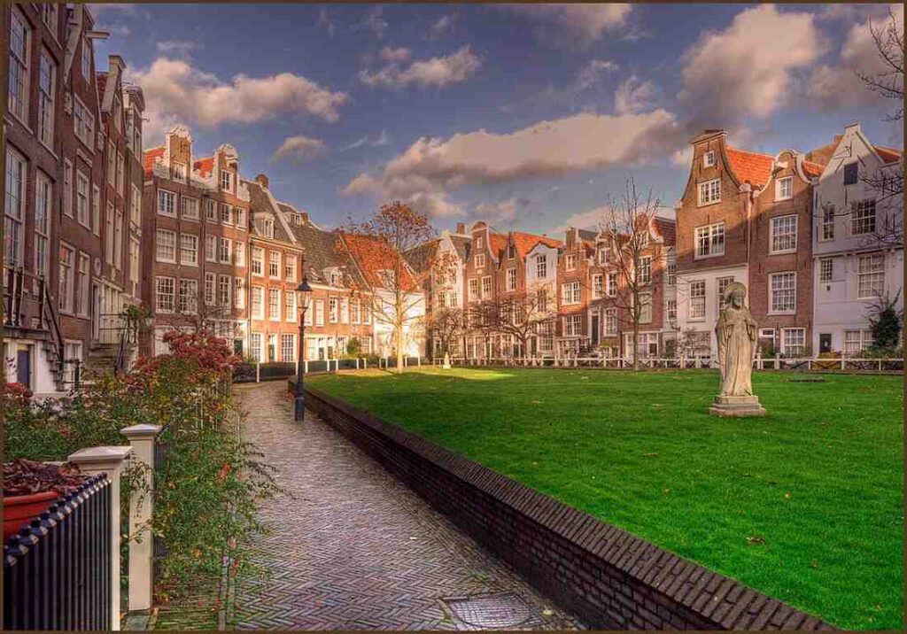 Quiet Begijnhof Courtyard in Amsterdam with historic houses and flowers
