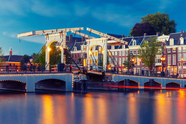 Magere Brug over Amstel River at sunset